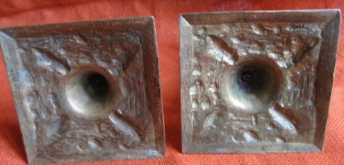 Pair of bronze candlesticks decorated with cherubs 19th century