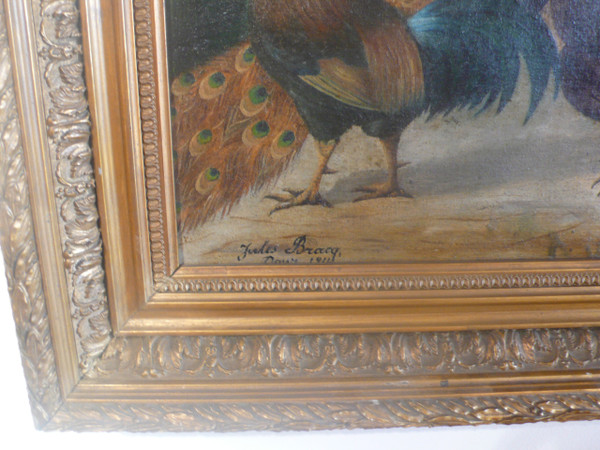 Tableau représentant un paon, un coq et un dindon signé Jules Bracq.