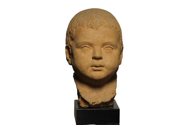 Scultura in terracotta rappresentante testa di bambino 