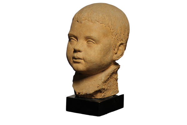 Scultura in terracotta rappresentante testa di bambino 