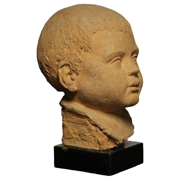Scultura in terracotta rappresentante testa di bambino 