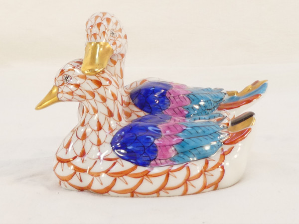 Couple of white porcelain ducks with orange fish scale net pattern 
