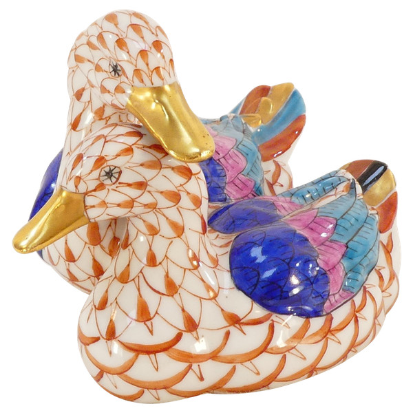 Couple of white porcelain ducks with orange fish scale net pattern 