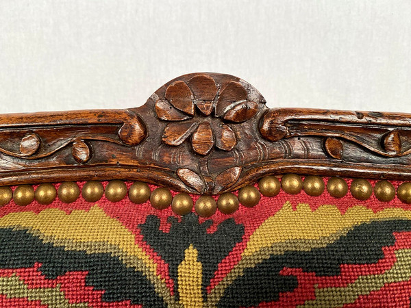 Louis XV-style bench seat upholstered with petit point tapestry, early 19th century