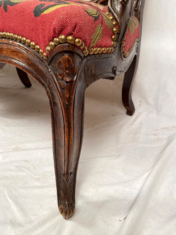 Louis XV-style bench seat upholstered with petit point tapestry, early 19th century