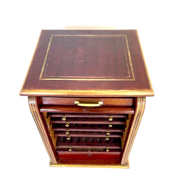 Antique cigar cabinet in mahogany and brass