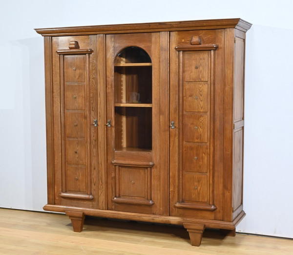 Oak bookcase with three doors