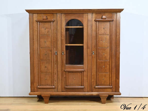 Oak bookcase with three doors