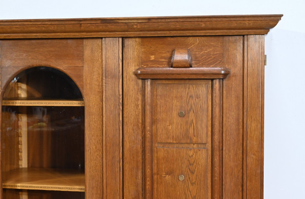 Oak bookcase with three doors