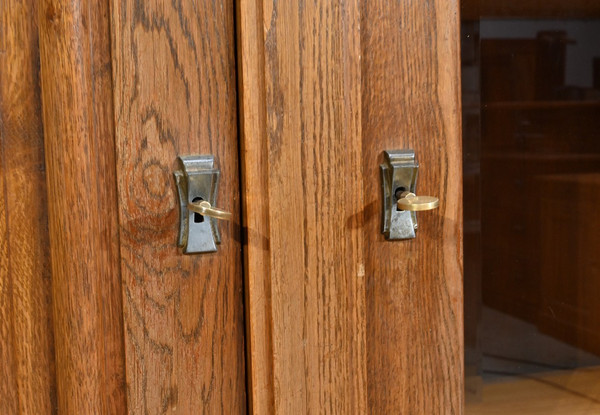 Oak bookcase with three doors