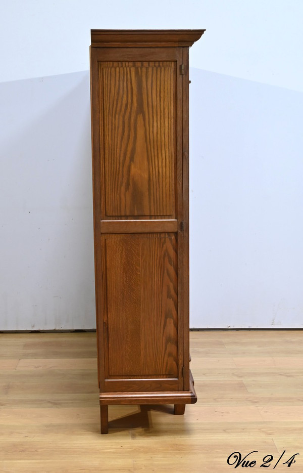 Oak bookcase with three doors