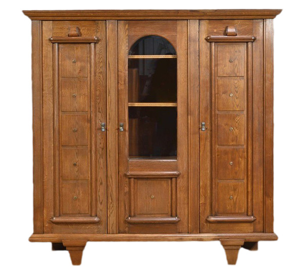Oak bookcase with three doors