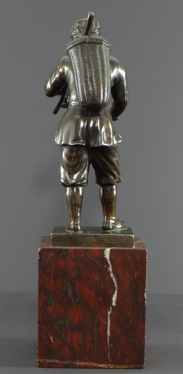 Italy, 18th Century, Bronze Statue Representing a Basket Carrier on a Marble Base.
