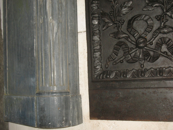 Louis XVI period fireplace in Turquin blue marble complete with its 18th century cast iron hearth 