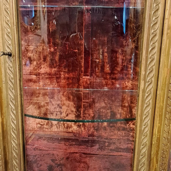 Louis XVI period display case, carved and gilded wood