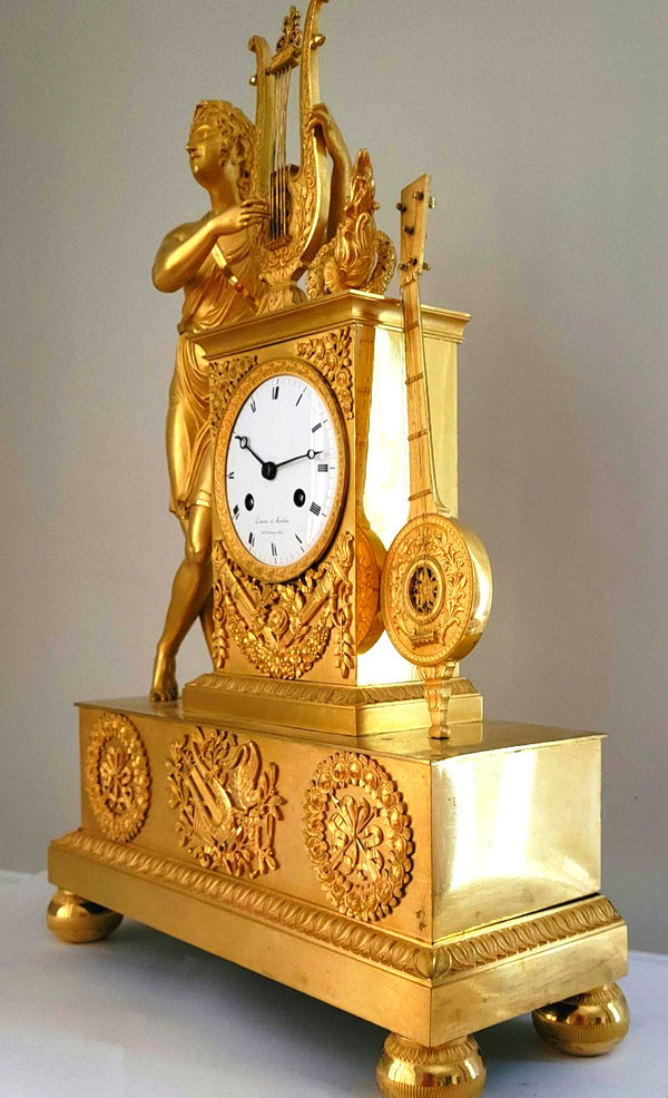 Empire "APOLLON" gilt bronze clock signed Denière et Matelin fabricants de bronzes.