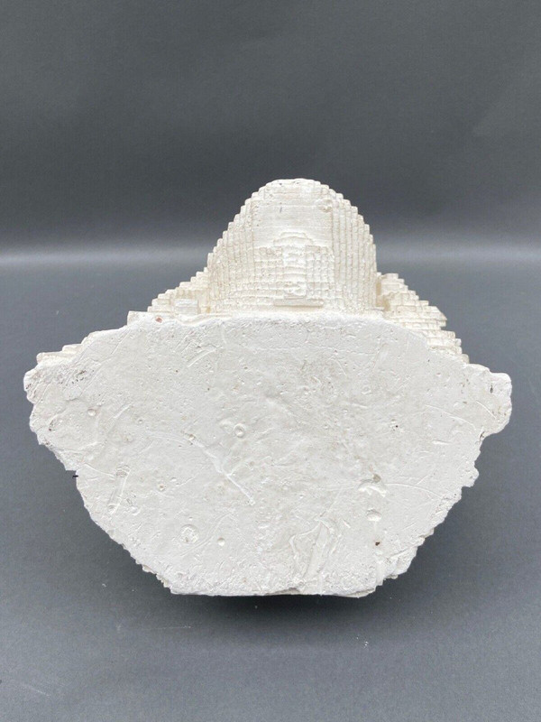 Sculpture in cellular concrete, pixelation of a man's face 1970