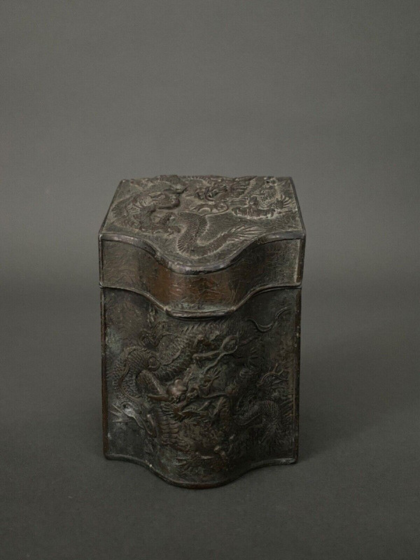 Asian tea caddy in 1900 metal with rich dragon ornamentation