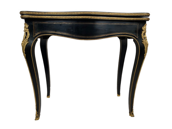 Console Napoléon III formant table à jeux, bois noirci et marqueterie de laiton