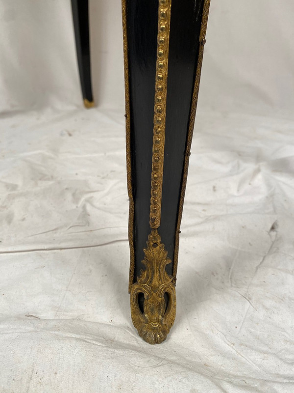 Console Napoléon III formant table à jeux, bois noirci et marqueterie de laiton