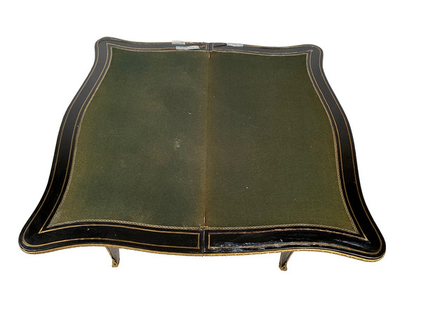 Console Napoléon III formant table à jeux, bois noirci et marqueterie de laiton