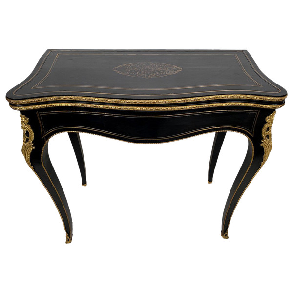 Console Napoléon III formant table à jeux, bois noirci et marqueterie de laiton