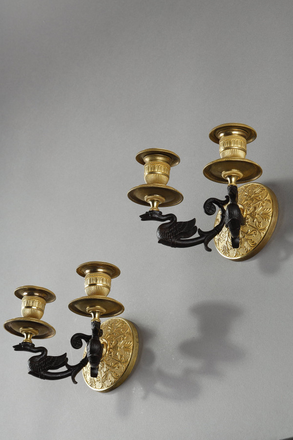Small pair of two-light ormolu sconces with brown patina