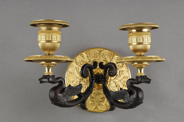 Small pair of two-light ormolu sconces with brown patina