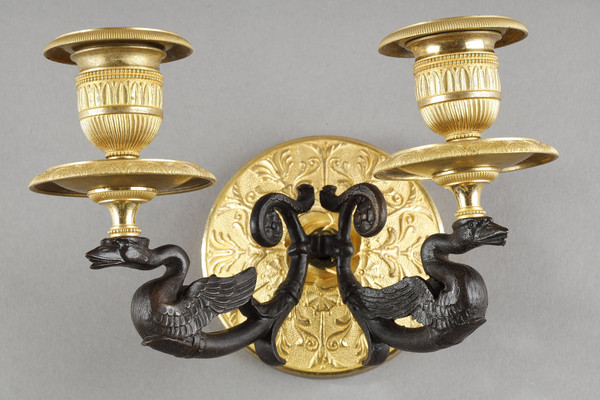Small pair of two-light ormolu sconces with brown patina
