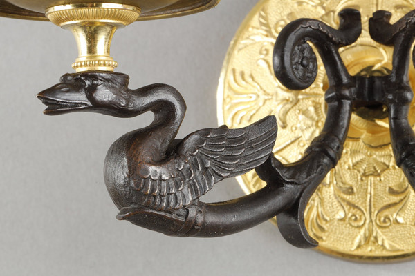 Small pair of two-light ormolu sconces with brown patina
