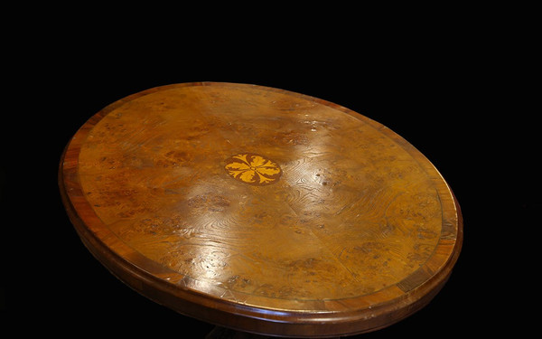 Oval table in marquetry and varnished wood 