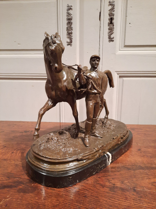 Bronze representing a jockey and his horse signed P.J. Mène 1866, 20th century.