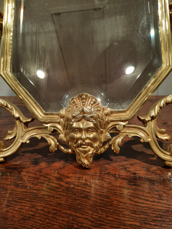 Miroir de salon en bronze de style Régence d’époque XIXème siècle.