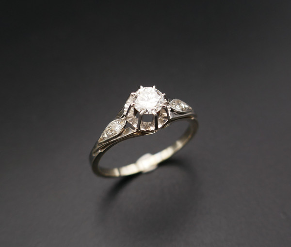 Diamond solitaire, gold and platinum setting.