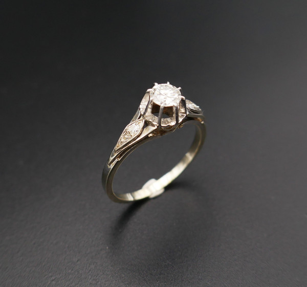 Diamond solitaire, gold and platinum setting.