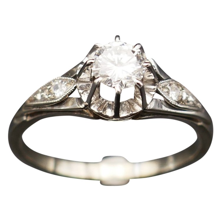 Diamond solitaire, gold and platinum setting.