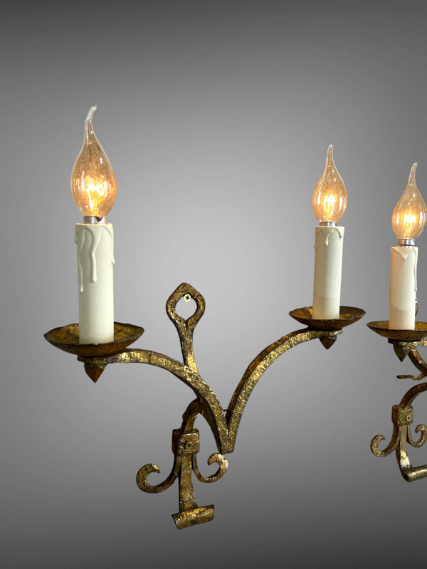PAIR OF WALLLIGHTS BY ROBERT AND ROGER THIBIER 20th CENTURY IN GILDED AND MARTELLED IRON