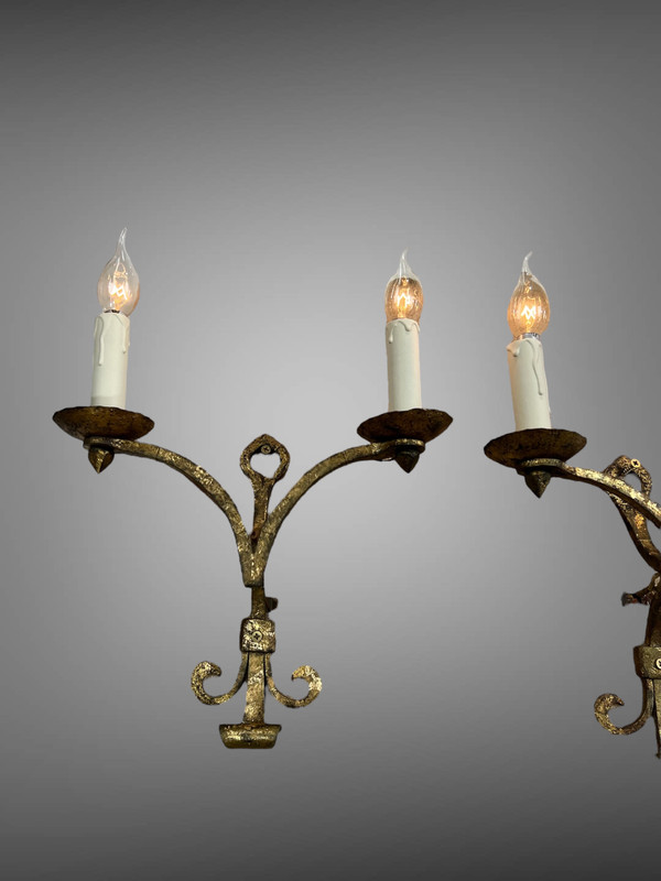 PAIR OF WALLLIGHTS BY ROBERT AND ROGER THIBIER 20th CENTURY IN GILDED AND MARTELLED IRON