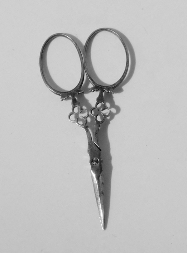Small pair of steel embroidery sewing scissors in its 19th century leather-covered case