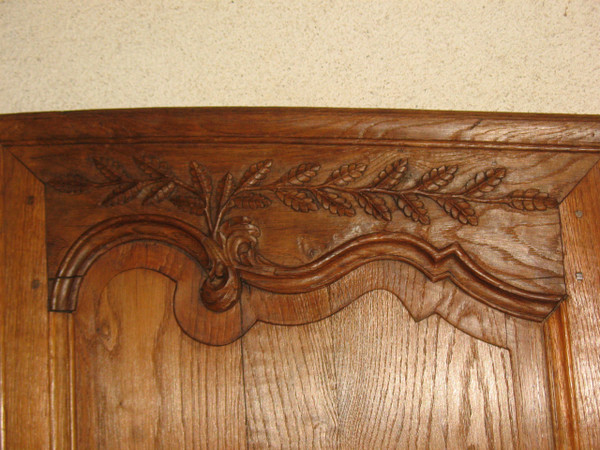Pair of Louis XV style woodwork doors in carved oak, early 19th century