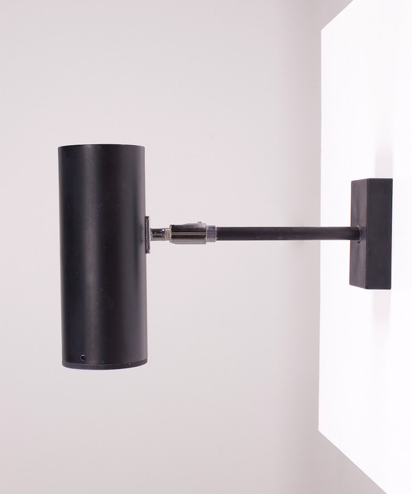 Modernistische, verstellbare Spot-Wandleuchte.