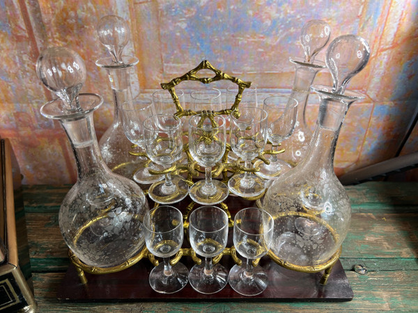 Napoleon III liqueur cellar in black wood, with brass fillets and chased glass portholes