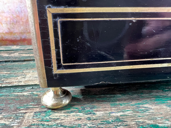 Napoleon III liqueur cellar in black wood, with brass fillets and chased glass portholes