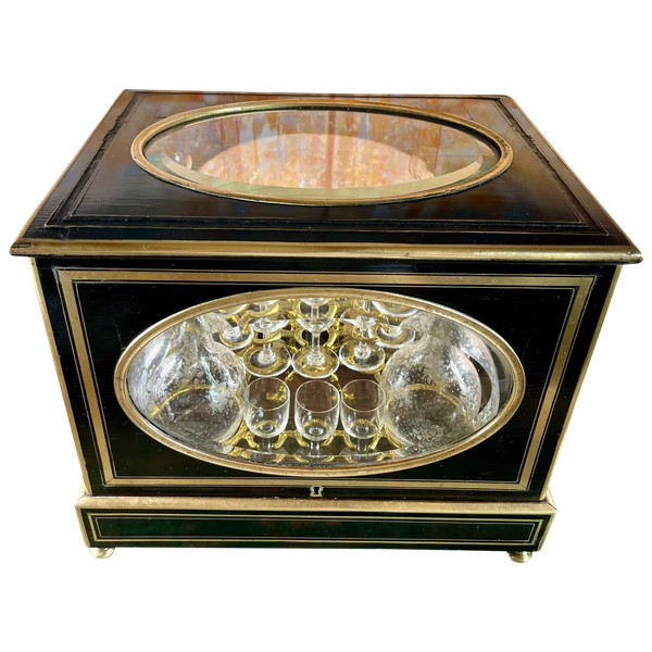 Napoleon III liqueur cellar in black wood, with brass fillets and chased glass portholes