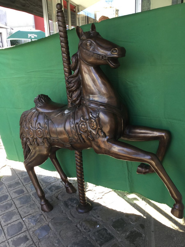 Bronze statue of a merry-go-round horse with brown patina 20th century