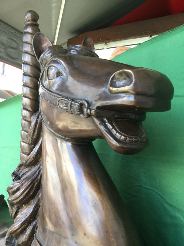 Bronze statue of a merry-go-round horse with brown patina 20th century