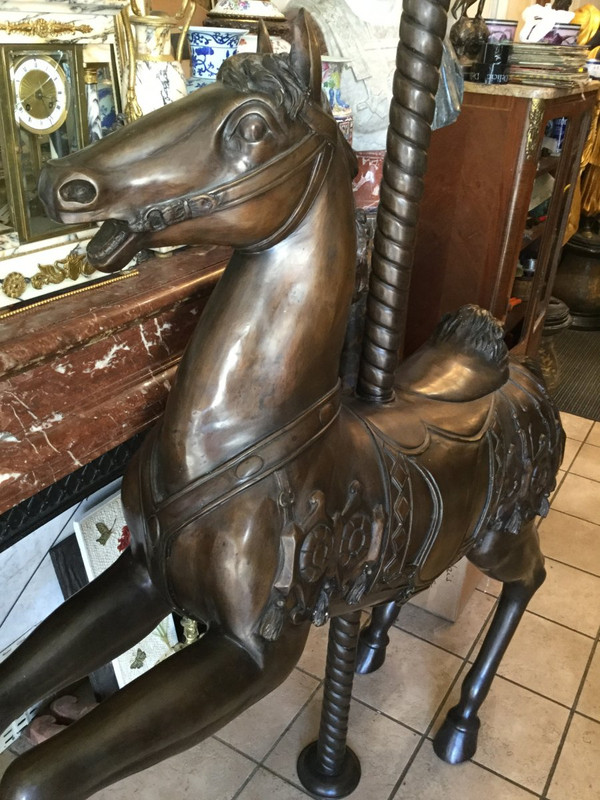 Bronze statue of a merry-go-round horse with brown patina 20th century