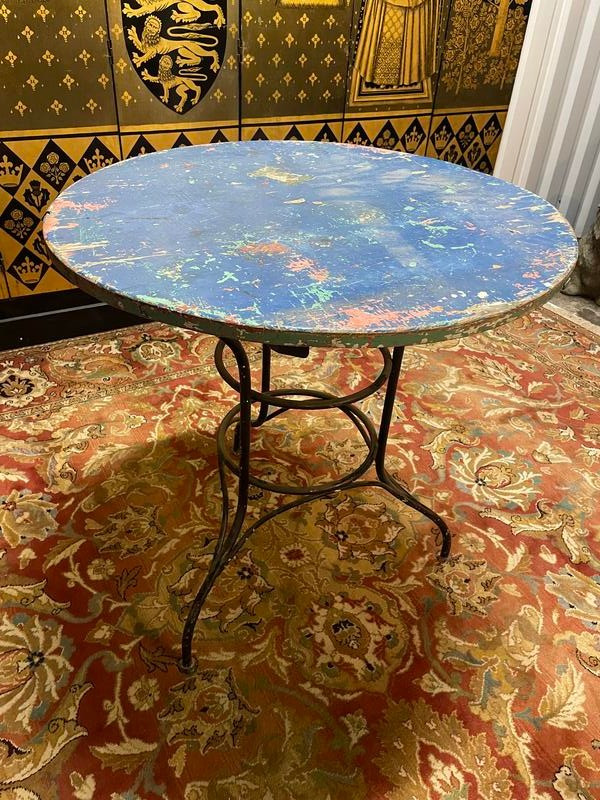 Wrought iron garden table with wooden top