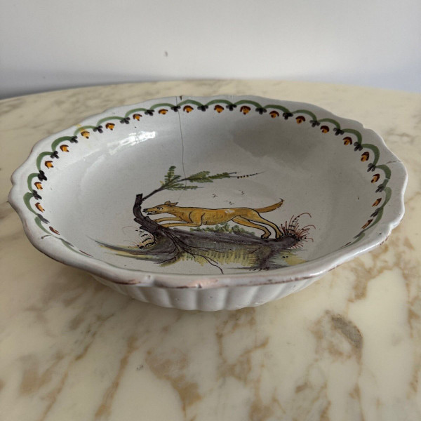 18th century Nevers earthenware salad bowl with gadrooned dog decoration