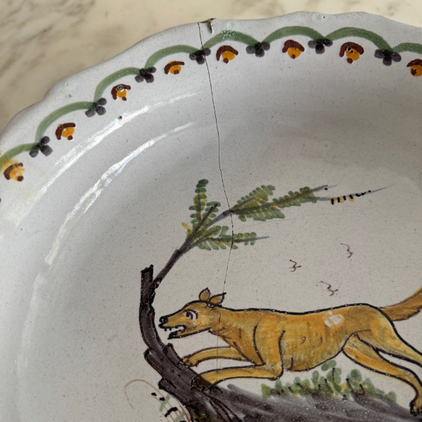 18th century Nevers earthenware salad bowl with gadrooned dog decoration